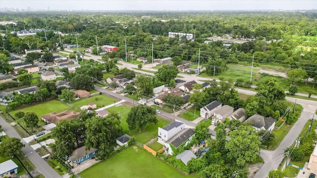 6902 Apollo St, Houston, TX 77091 - aerial perspective of suburban area featuring a forest