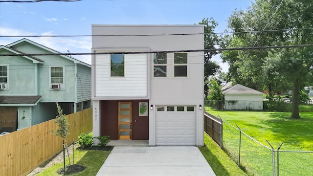 6902 Apollo St, Houston, TX 77091 - view of front facade featuring a garage and driveway