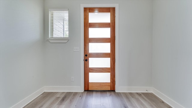 6902 Apollo St, Houston, TX 77091 - entryway featuring light wood-type flooring and baseboards
