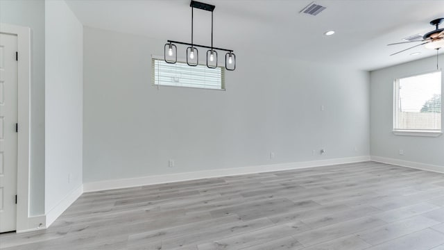6902 Apollo St, Houston, TX 77091 - unfurnished dining area with ceiling fan, light wood-type flooring, and recessed lighting