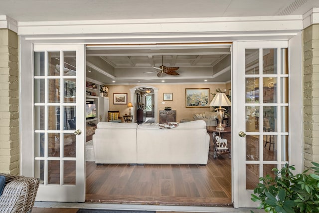 13306 Boca Raton Dr, Houston, TX 77069 - living room featuring french doors, wood finished floors, a ceiling fan, ornamental molding, and arched walkways