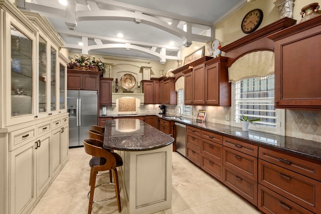 13306 Boca Raton Dr, Houston, TX 77069 - kitchen featuring stainless steel appliances, a kitchen breakfast bar, dark stone counters, decorative backsplash, and beamed ceiling