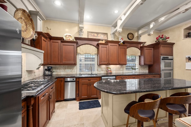 13306 Boca Raton Dr, Houston, TX 77069 - kitchen with appliances with stainless steel finishes, backsplash, crown molding, a breakfast bar area, and a kitchen island