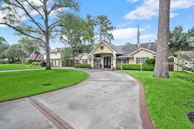 13306 Boca Raton Dr, Houston, TX 77069 - ranch-style home featuring a front yard and curved driveway