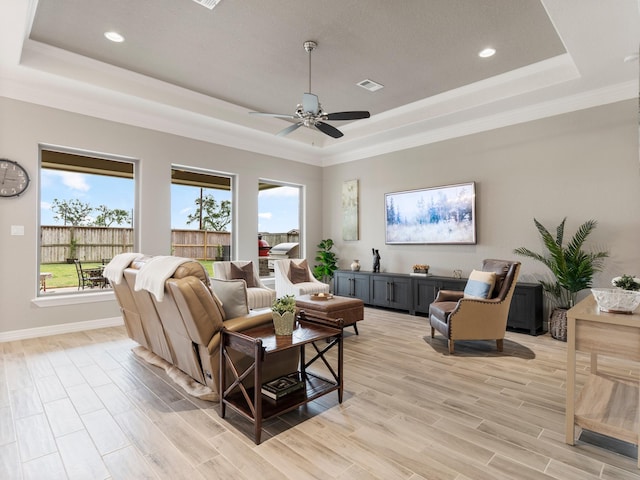 103 Lakeshore Ct, Clute, TX 77531 - living area with a tray ceiling, a ceiling fan, crown molding, light wood-type flooring, and recessed lighting