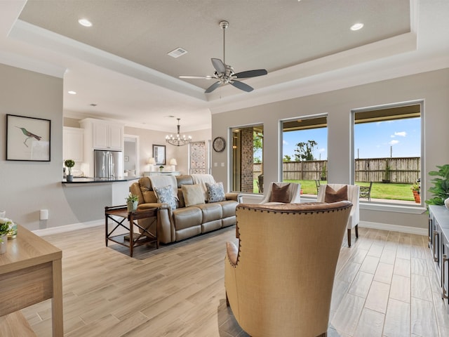 103 Lakeshore Ct, Clute, TX 77531 - living room featuring a tray ceiling, a chandelier, healthy amount of natural light, crown molding, and recessed lighting