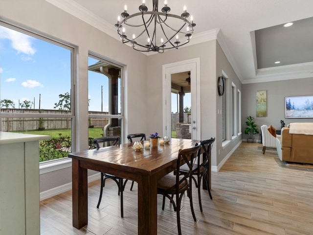 103 Lakeshore Ct, Clute, TX 77531 - dining room featuring healthy amount of natural light, crown molding, a chandelier, light wood-type flooring, and recessed lighting