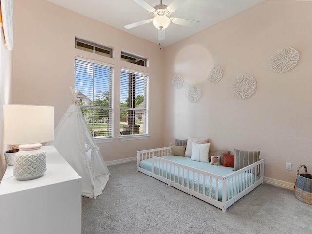 103 Lakeshore Ct, Clute, TX 77531 - carpeted bedroom with baseboards and ceiling fan