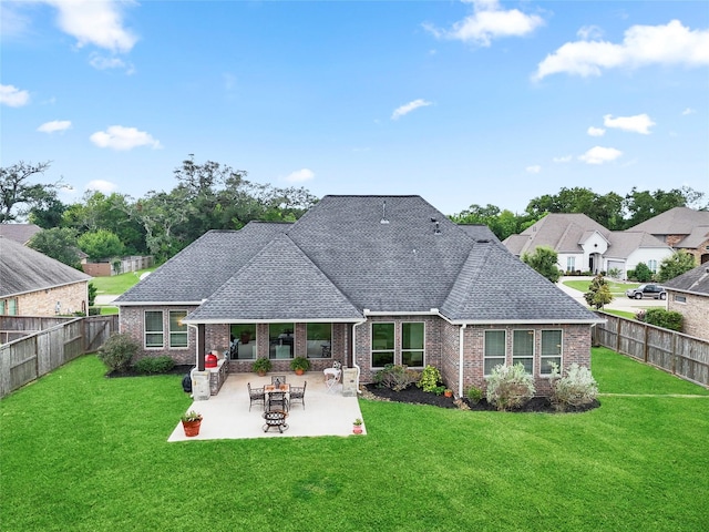 103 Lakeshore Ct, Clute, TX 77531 - back of house featuring roof with shingles, brick siding, and a fenced backyard