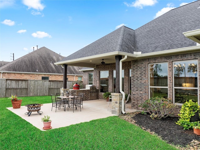 103 Lakeshore Ct, Clute, TX 77531 - view of patio with exterior kitchen and an outdoor fire pit