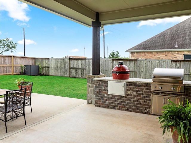 103 Lakeshore Ct, Clute, TX 77531 - fenced backyard featuring area for grilling, a patio, and outdoor dining area
