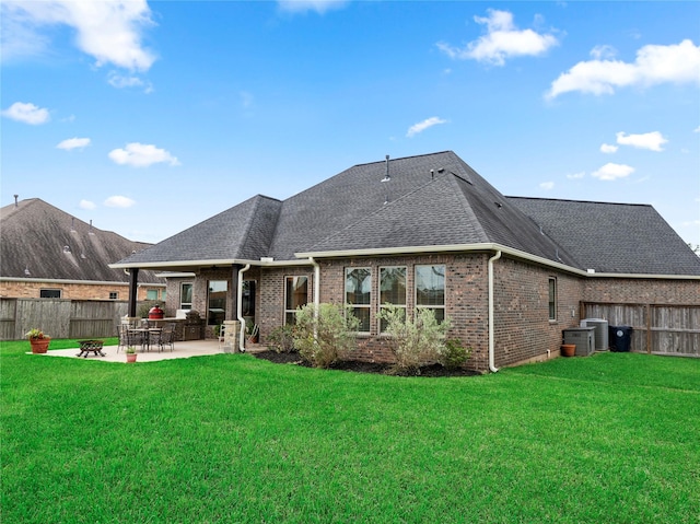 103 Lakeshore Ct, Clute, TX 77531 - rear view of property with brick siding, a patio, a fenced backyard, and roof with shingles