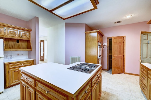 3134 Lake Island Dr, Montgomery, TX 77356 - kitchen featuring white appliances, backsplash, light countertops, and brown cabinetry