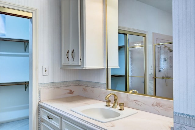 3134 Lake Island Dr, Montgomery, TX 77356 - full bath with vanity, a walk in closet, and an enclosed shower