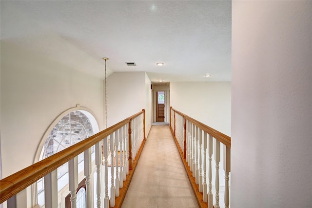 3134 Lake Island Dr, Montgomery, TX 77356 - hallway with lofted ceiling and light colored carpet