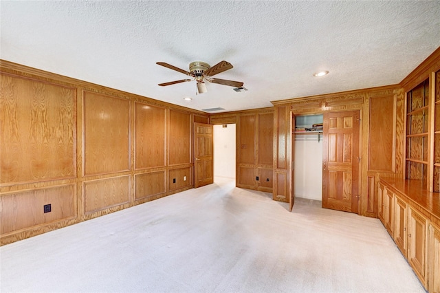 3134 Lake Island Dr, Montgomery, TX 77356 - unfurnished bedroom featuring a closet, light carpet, a textured ceiling, a ceiling fan, and recessed lighting