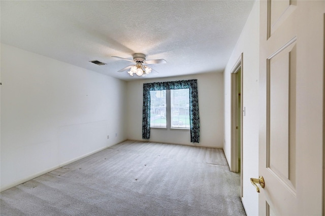 3134 Lake Island Dr, Montgomery, TX 77356 - empty room featuring light carpet, a textured ceiling, and ceiling fan