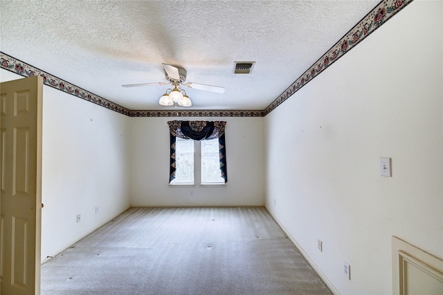 3134 Lake Island Dr, Montgomery, TX 77356 - unfurnished room featuring light colored carpet, ceiling fan, and a textured ceiling