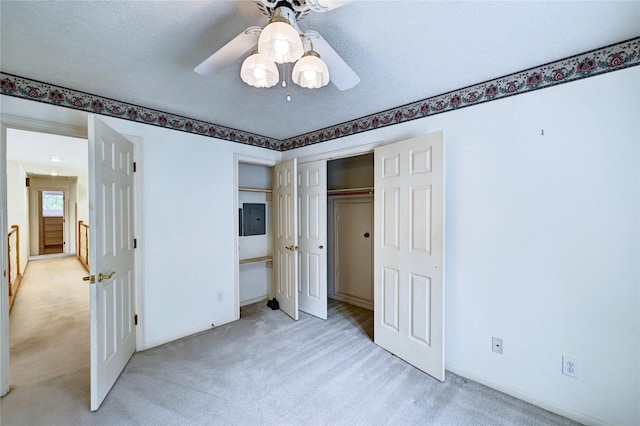 3134 Lake Island Dr, Montgomery, TX 77356 - unfurnished bedroom with light colored carpet, electric panel, a closet, and ceiling fan