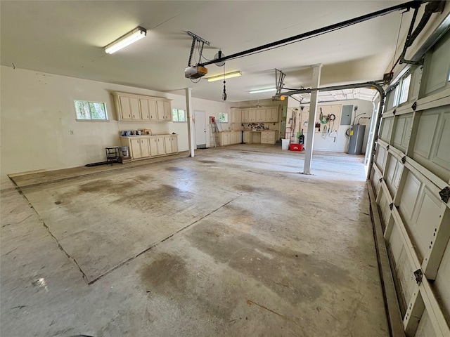 3134 Lake Island Dr, Montgomery, TX 77356 - garage featuring a garage door opener and electric panel