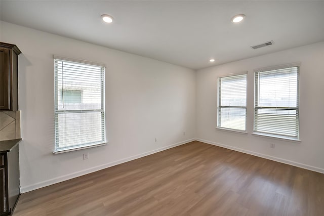 4918 Eldorado Rose Pl, Katy, TX 77493 - empty room with wood finished floors and recessed lighting