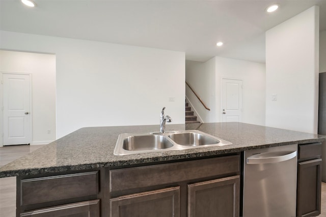 4918 Eldorado Rose Pl, Katy, TX 77493 - kitchen with dishwasher, an island with sink, dark brown cabinetry, light wood finished floors, and recessed lighting