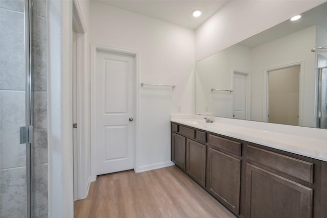 4918 Eldorado Rose Pl, Katy, TX 77493 - bathroom with vanity, a stall shower, and wood finished floors