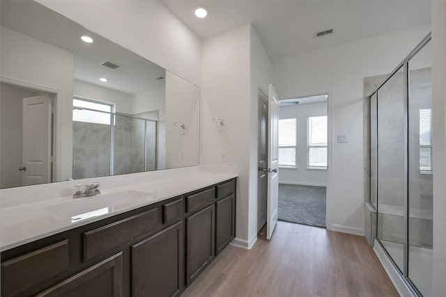 4918 Eldorado Rose Pl, Katy, TX 77493 - full bath featuring healthy amount of natural light, a stall shower, vanity, wood finished floors, and recessed lighting
