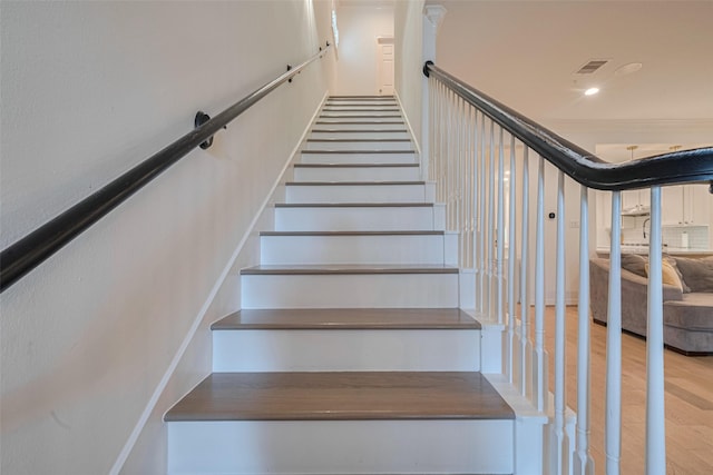 14439 Basalt Ln, Houston, TX 77077 - stairway featuring wood finished floors and recessed lighting