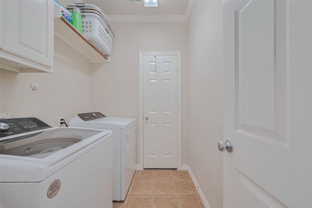 14439 Basalt Ln, Houston, TX 77077 - laundry room featuring washing machine and clothes dryer, cabinet space, crown molding, and light tile patterned floors