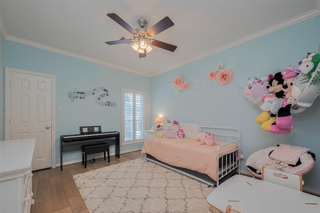 14439 Basalt Ln, Houston, TX 77077 - bedroom featuring ornamental molding, wood finished floors, and a ceiling fan