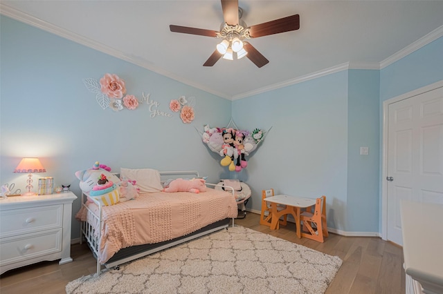 14439 Basalt Ln, Houston, TX 77077 - bedroom featuring wood finished floors, ornamental molding, and a ceiling fan