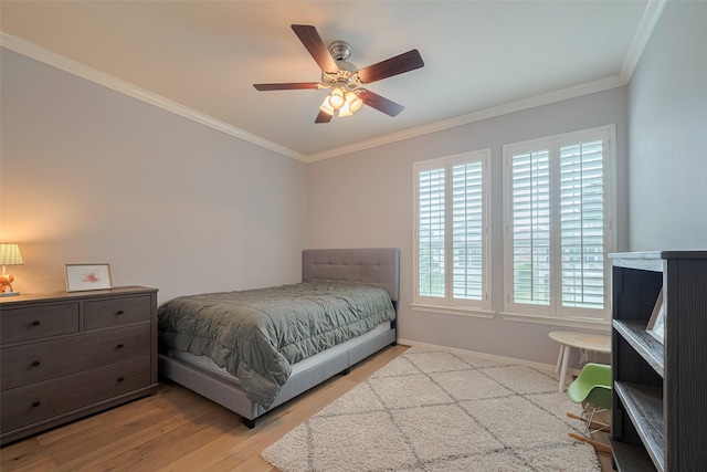 14439 Basalt Ln, Houston, TX 77077 - bedroom featuring multiple windows, crown molding, light wood finished floors, and a ceiling fan