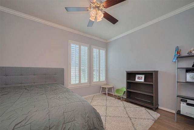14439 Basalt Ln, Houston, TX 77077 - bedroom with crown molding, wood finished floors, and a ceiling fan