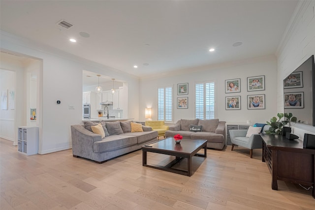 14439 Basalt Ln, Houston, TX 77077 - living room with ornamental molding, light wood-style floors, and recessed lighting