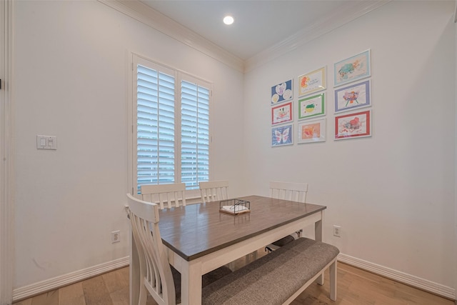 14439 Basalt Ln, Houston, TX 77077 - dining area featuring light wood-type flooring, crown molding, and recessed lighting
