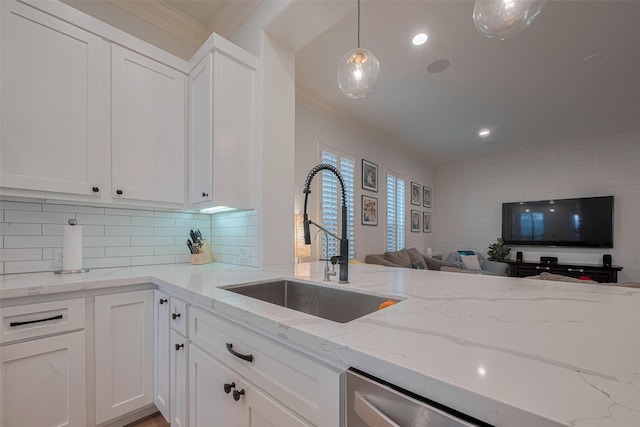 14439 Basalt Ln, Houston, TX 77077 - kitchen featuring crown molding, open floor plan, white cabinets, light stone counters, and tasteful backsplash