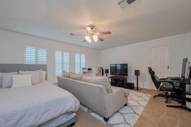 14439 Basalt Ln, Houston, TX 77077 - bedroom with light colored carpet, an office area, and a ceiling fan