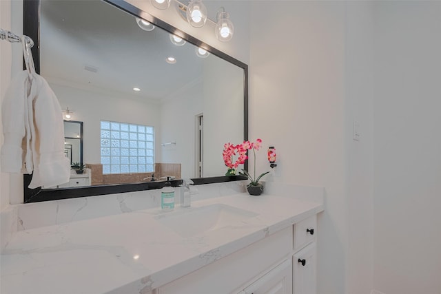 14439 Basalt Ln, Houston, TX 77077 - bathroom featuring ornamental molding, vanity, and recessed lighting