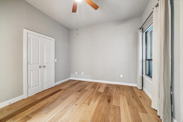 1901 Post Oak Blvd Unit 1206, Houston, TX 77056 - unfurnished bedroom with light wood finished floors and a ceiling fan