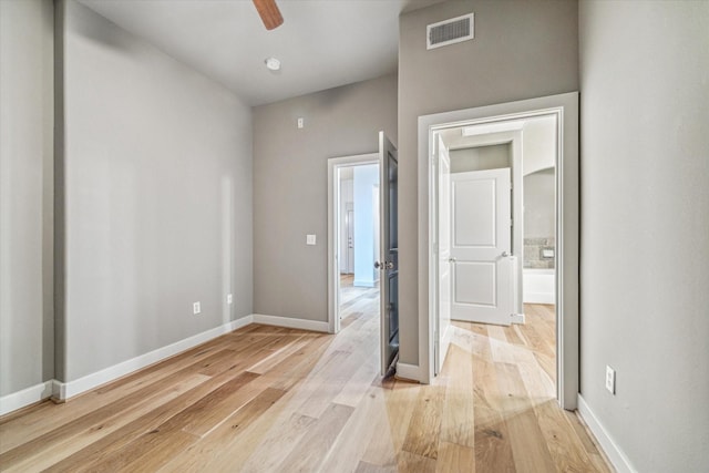 1901 Post Oak Blvd Unit 1206, Houston, TX 77056 - unfurnished bedroom with light wood-type flooring and a ceiling fan