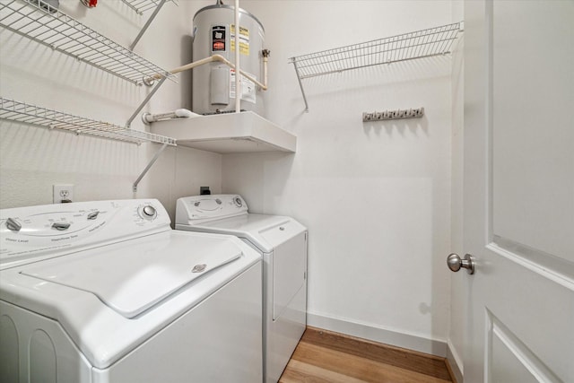 1901 Post Oak Blvd Unit 1206, Houston, TX 77056 - laundry area with separate washer and dryer, water heater, and light wood-style floors