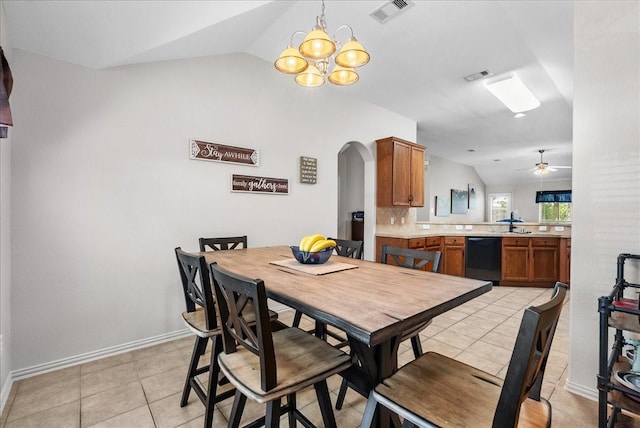 1803 Winding Trail Ln, Alvin, TX 77511 - dining space featuring lofted ceiling, arched walkways, a chandelier, a ceiling fan, and light tile patterned floors