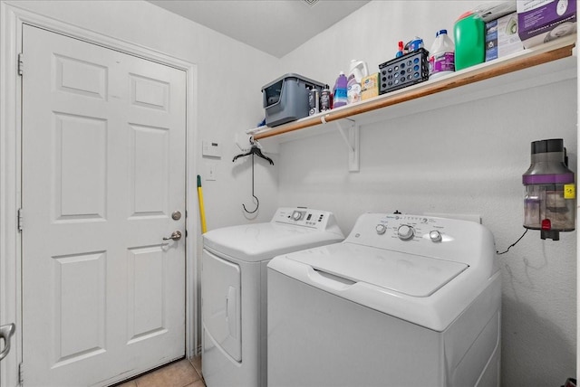 1803 Winding Trail Ln, Alvin, TX 77511 - washroom with washer and dryer and light tile patterned floors