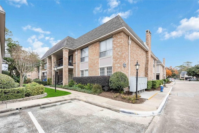 2230 S Piney Point Rd Unit 206, Houston, TX 77063 - view of building exterior featuring uncovered parking