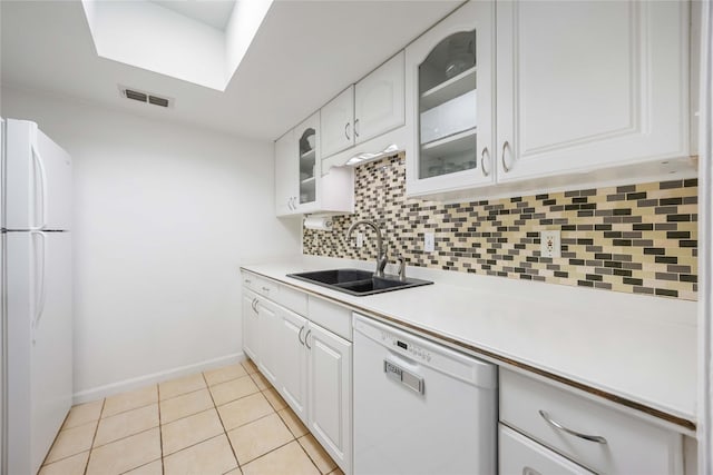 2230 S Piney Point Rd Unit 206, Houston, TX 77063 - kitchen with white appliances, decorative backsplash, glass insert cabinets, white cabinetry, and light countertops