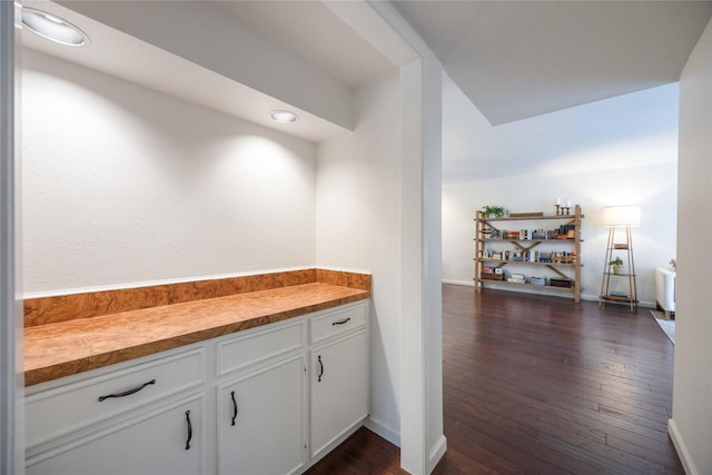 2230 S Piney Point Rd Unit 206, Houston, TX 77063 - bar featuring dark wood-style flooring and baseboards