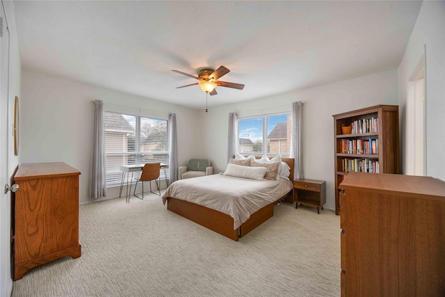 2230 S Piney Point Rd Unit 206, Houston, TX 77063 - bedroom with light colored carpet and ceiling fan