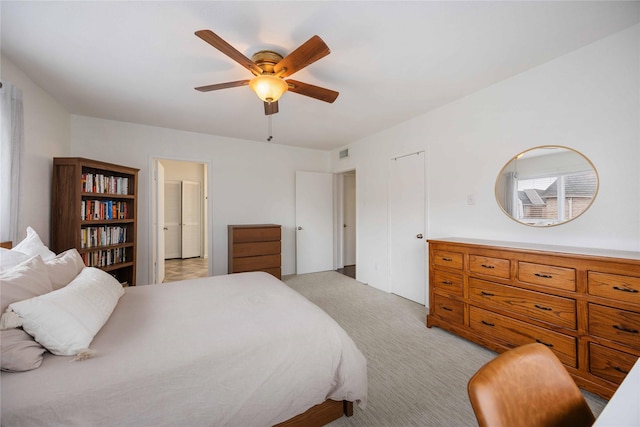 2230 S Piney Point Rd Unit 206, Houston, TX 77063 - bedroom with light colored carpet and ceiling fan