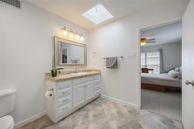 2230 S Piney Point Rd Unit 206, Houston, TX 77063 - bathroom with a skylight, vanity, and ensuite bathroom